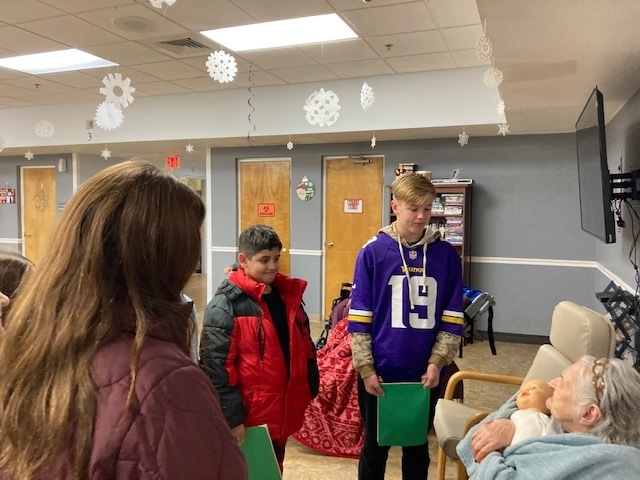 Students visited with residents after singing carols.