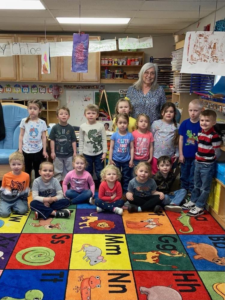 The Rotary Club donates books to preschool students.